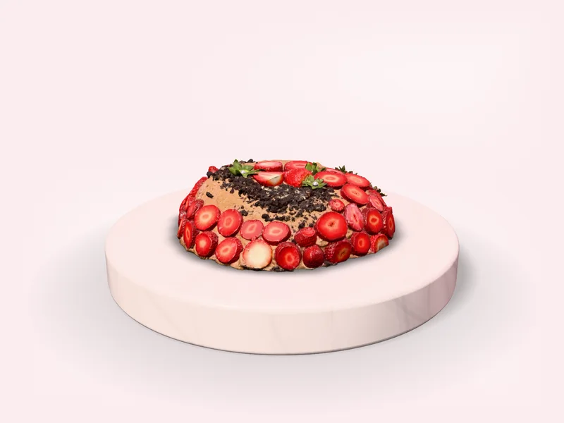 Bánh Dâu Tầng cỡ 14 cm nhỏ gọn giữa bệ cẩm thạch trắng, lát dâu tây đỏ phủ quanh thành, mặt rắc vụn sô-cô-la, còn chừa rộng mép bệ